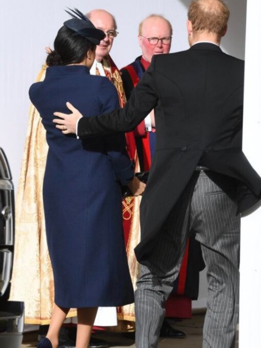 Harry put his arm around Meghan as the pair arrived. Picture: Twitter