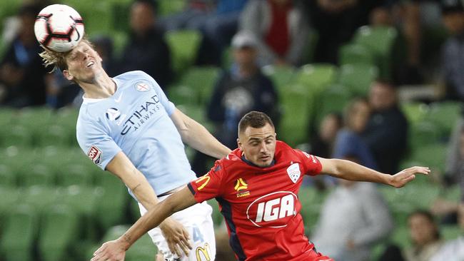 Harrison Delbridge over Adelaide opponent Jordy Thomassen. Picture: AAP