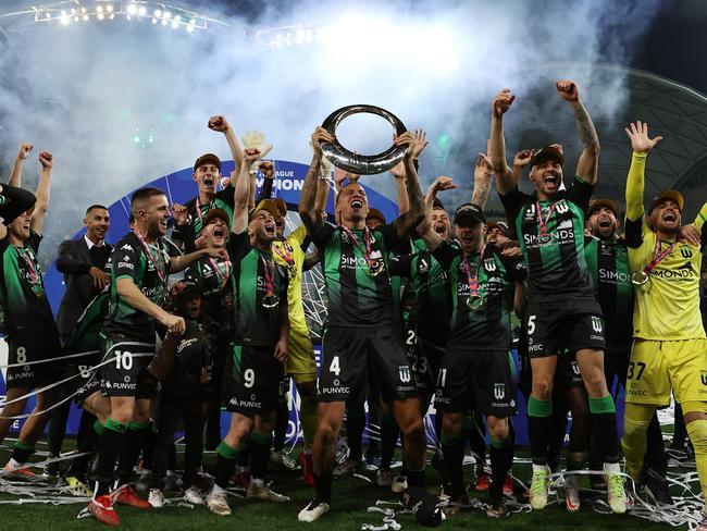 MELBOURNE, AUSTRALIA - MAY 28: Leo Lacroix of Western United holds the trophy aloft during the A-League Mens Grand Final match between Western United and Melbourne City at AAMI Park on May 28, 2022, in Melbourne, Australia. (Photo by Robert Cianflone/Getty Images)