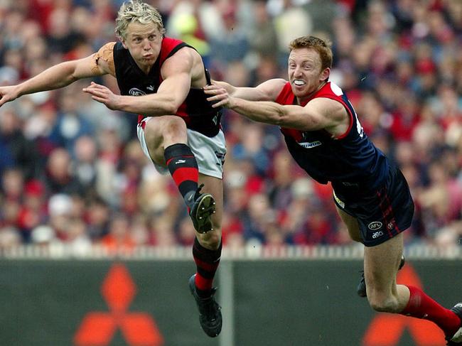 Troy Broadbridge pressures Essendon’s Mark Johnson in the 2004 elimination final.