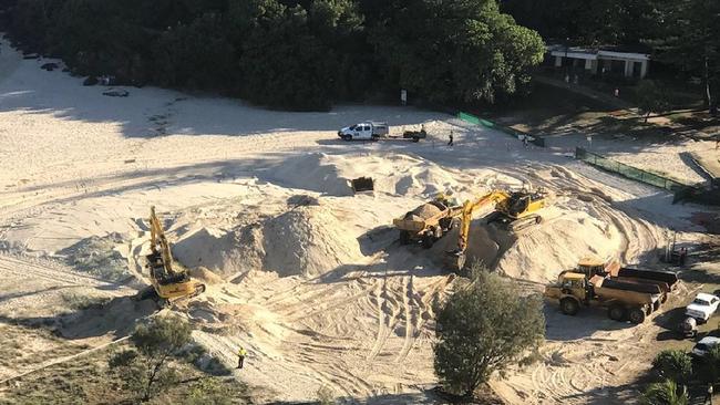 Bulldozers on the beach at Greenmount