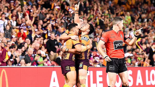 Alex Glenn points to the sky after the Broncos came from behind to beat the Raiders. (AAP Image/Albert Perez)