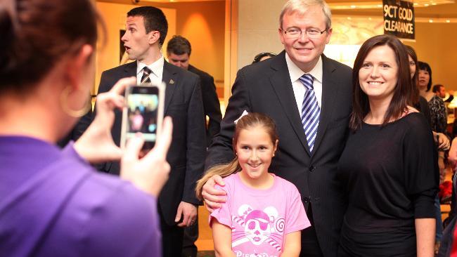 Kevin Rudd poses for pictures with well-wishers during a visit to Carindale shopping centre. Picture: Adam Smith