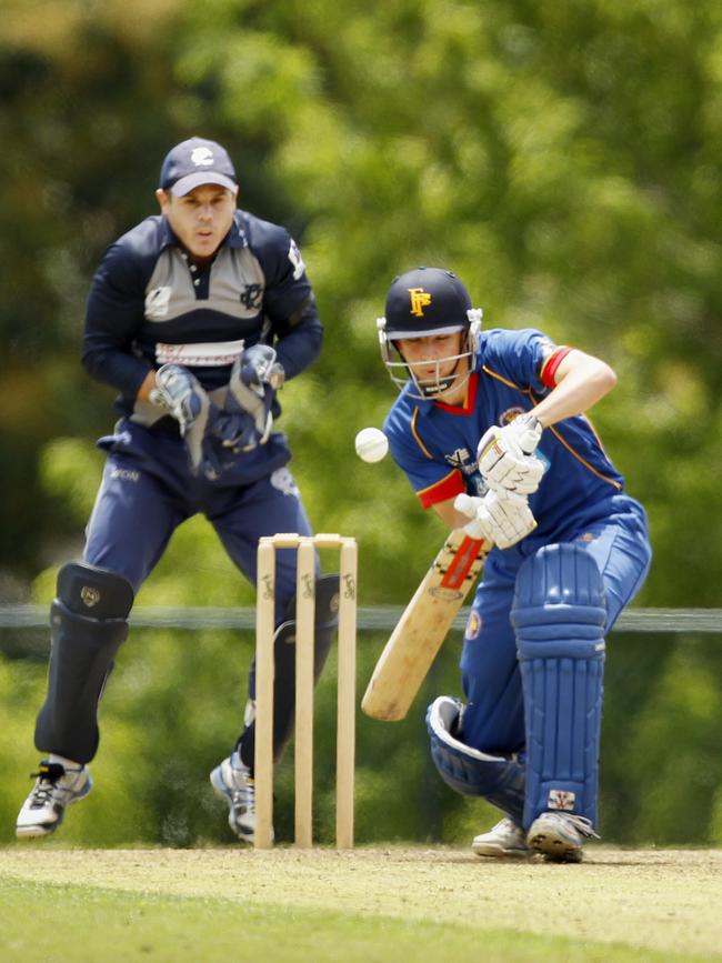 Voelkl batting for Frankston Peninsula in 2013, with Prahran keeper Sam Coates looking on.