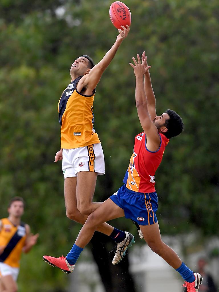 Essendon District: Strathmore’&#149;s Athan Tsialtas flies over the top of Maribyrnong Park’s Kyle Baker. Picture: Andy Brownbill