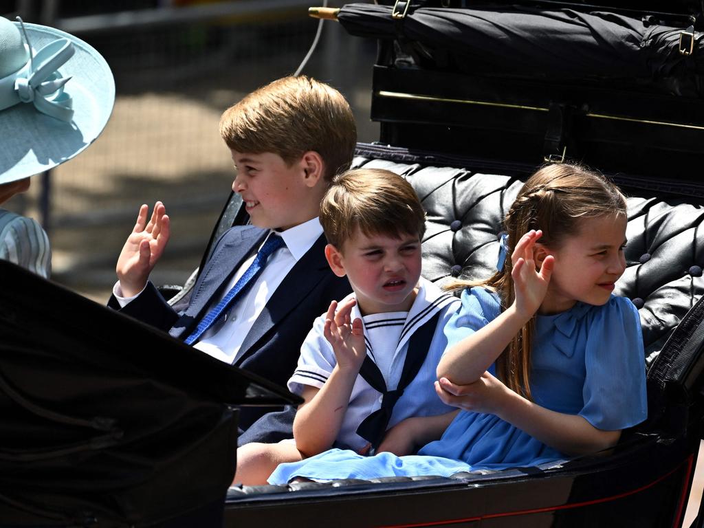 Prince Louis, centre with his brother and sister, has been described as his mother’s “mini me”. Picture: AFP