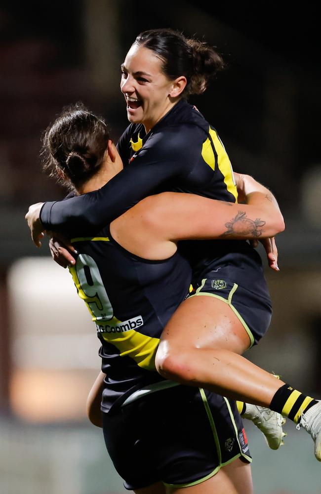 Caitlin Greiser and Monique Conti celebrate a goal against Carlton. Picture: Dylan Burns/AFL Photos via Getty Images.