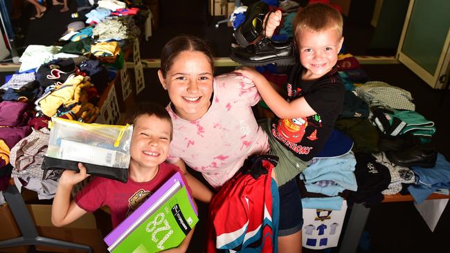 Rhys, 7, Sasha, 14, and Declan,4, Packham at the School Savvy NQ Pop Up Back to School supply shop. Picture: Shae Beplate.