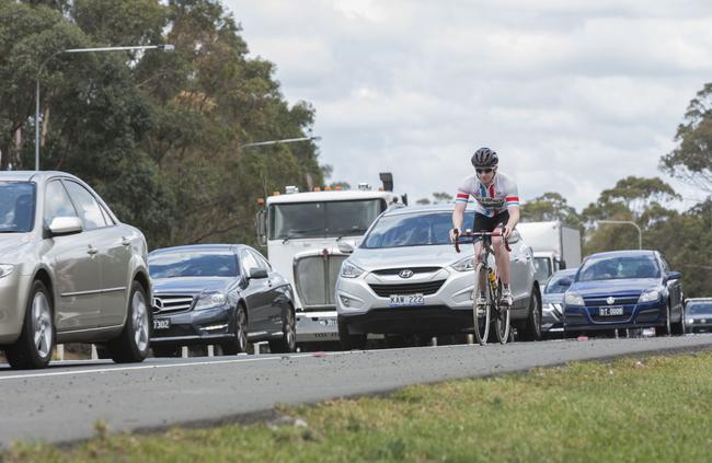 Sam Playford cycling along Narellan Road. Picture: Matthew Vasilescu.