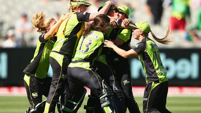 Thunder players celebrate after they defeated the Sixers during the Women's Big Bash League Final.