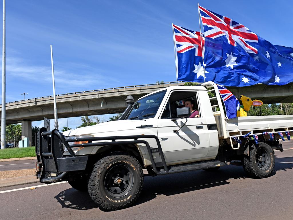 A ute rounds the corner at the Ludmilla flyover as part of the annual Variety NT Australia Day Ute run. Picture: Che Chorley