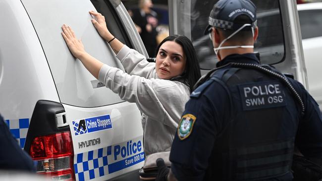 A woman was detained and searched by police at Bass Hill Shopping Plaza. Picture: NCA NewsWire/Jeremy Piper