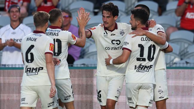 GOSFORD, AUSTRALIA - DECEMBER 13: Archie Goodwin of Adelaide United celebrates a goal with team mates during the round eight A-League Men match between Central Coast Mariners and Adelaide United at Industree Group Stadium, on December 13, 2024, in Gosford, Australia. (Photo by Scott Gardiner/Getty Images)