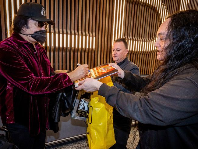 Gene Simmons signs autographs for fans upon arrival at Melbourne Airport to begin the Australian leg of the End of the Road Tour. Picture: Jake Nowakowski