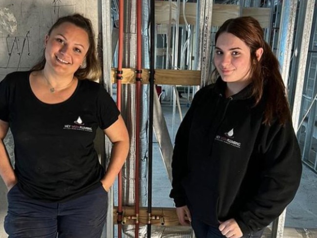Kimberley Smyth, left, and daughter Lara Smyth, right, at work for Hey Sista Plumbing. Picture: Supplied.