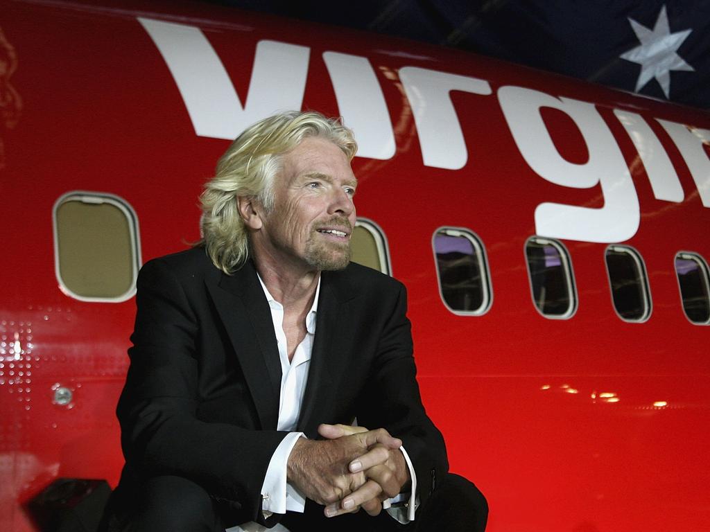 Sir Richard Branson celebrates Virgin Blue’s 10th anniversary in Australia at Melbourne Airport in 2010. Picture: Robert Prezioso/Getty Images