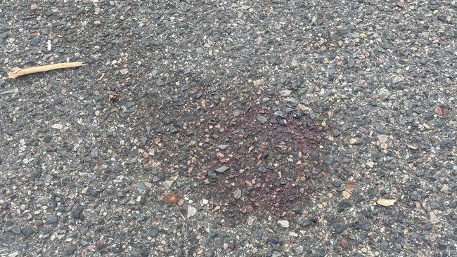 Blood stains in the carpark at the Rapid Creek Business Village where a man, believed to be in his 40s, was allegedly assaulted and later died from his injuries at the scene about 9.30pm Tuesday. Picture: Annabel Bowles