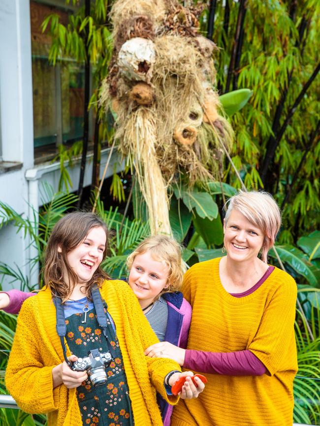 Clare James with her daughters Lylah and Olive and her artwork The Last Resort.