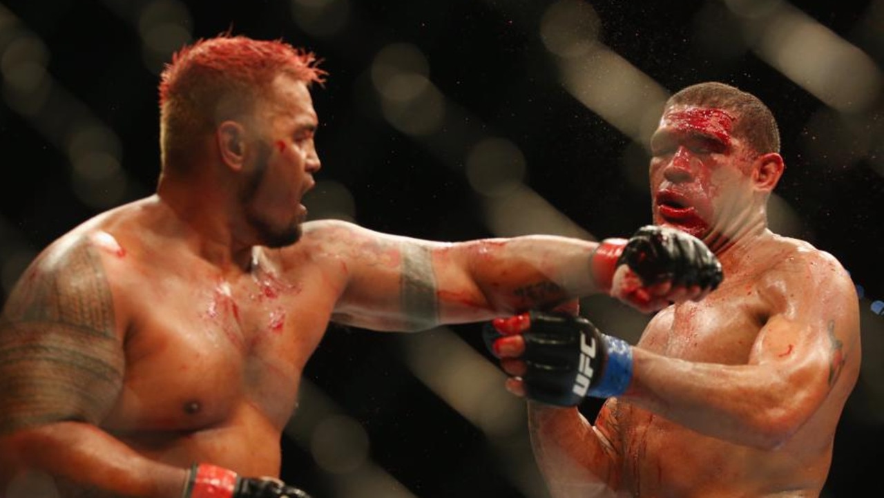BRISBANE, AUSTRALIA - DECEMBER 07: Mark Hunt punches Antonio 'Big Foot' Silva of Brazil during the UFC Brisbane bout between Mark Hunt and Antonio 'Big Foot' Silva of Brazil at Brisbane Entertainment Centre on December 7, 2013 in Brisbane, Australia. (Photo by Chris Hyde/Getty Images)