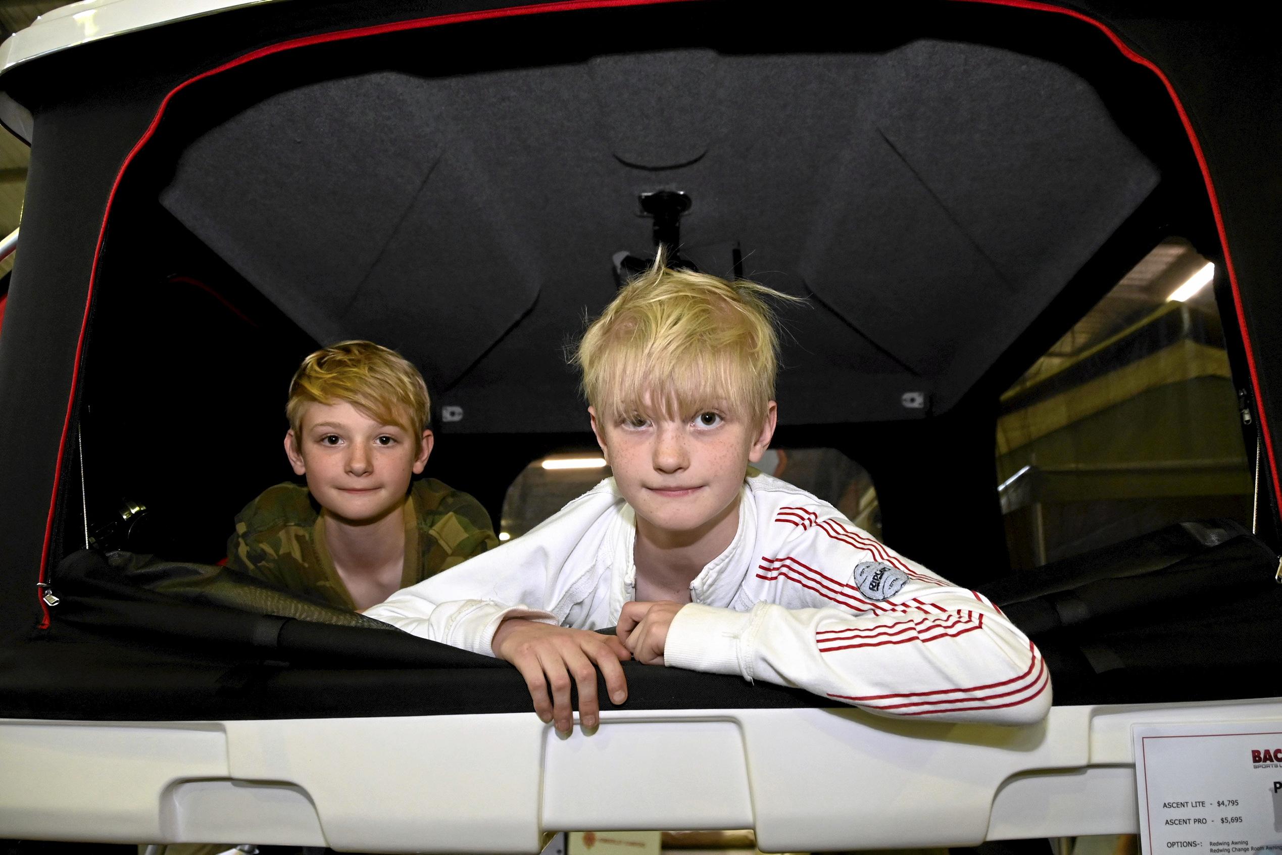 Trying out the beds in this display caravan are brothers Jonathan and Alexander Dyer of Toowoomba.  August 2019. Picture: Bev Lacey