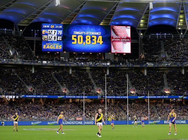 PERTH, AUSTRALIA - JUNE 13: The crowd attendance can be seen during the 2021 AFL Round 13 match between the West Coast Eagles and the Richmond Tigers at Optus Stadium on June 13, 2021 in Perth, Australia. (Photo by Will Russell/AFL Photos via Getty Images)