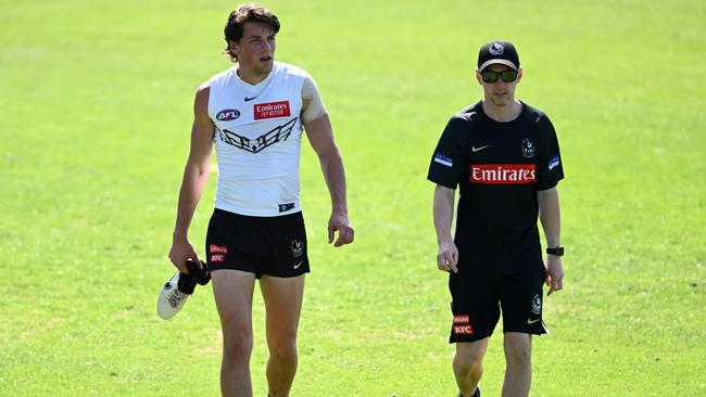 Pat Lipinski walks off the field at Victoria Park after rolling his ankle at training on Monday. Picture: Quinn Rooney / Getty Images