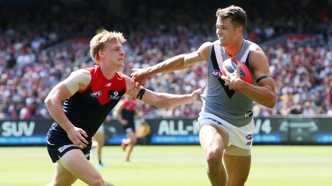 Port Adelaide’s Ryan Burton shrugs aside Charlie Spargo. Picture: Michael Klein.