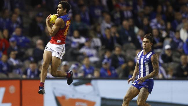 Charlie Cameron flies high to mark in front of North Melbourne’s Marley Williams. Picture: Daniel Pockett. 