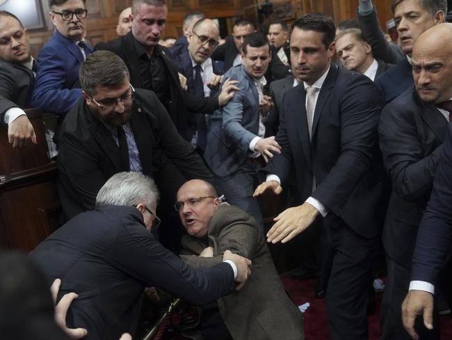 Ruling party lawmakers, opposition members, and some ministers fight during a Serbia's parliament session, which was scheduled to debate the 2025 budget, in Belgrade, Serbia, Monday, Nov. 25, 2024. (AP Photo)