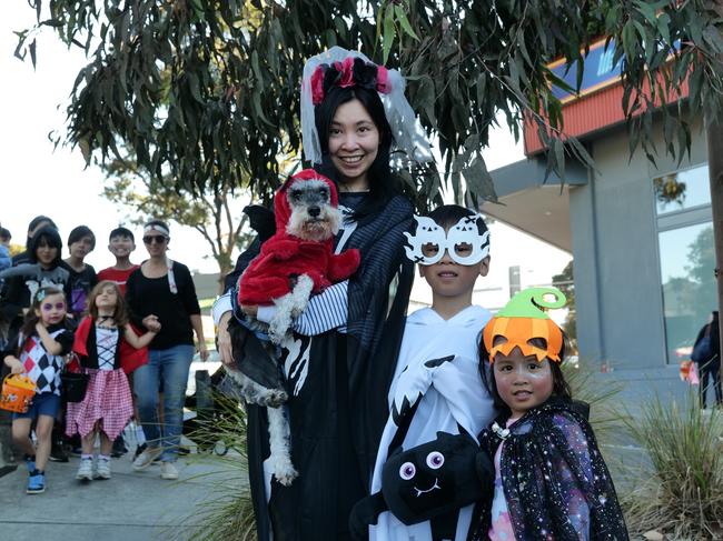 Winnie, Winston, Kendra and their dog Leo all dressed up at the Greythorn Halloween festival.