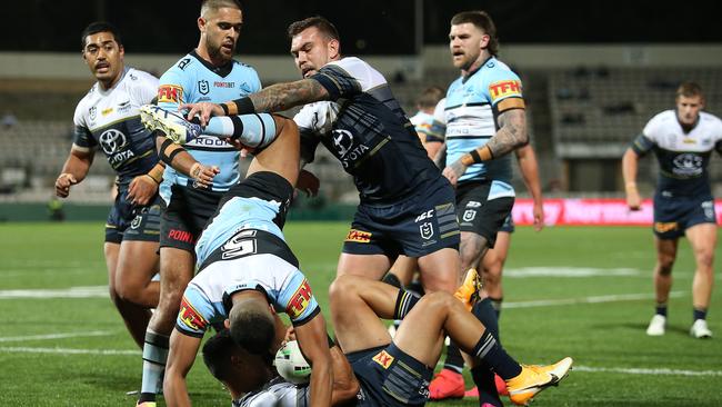 Ronaldo Mulitalo gets that upside down feeling while tackling Valentine Holmes.