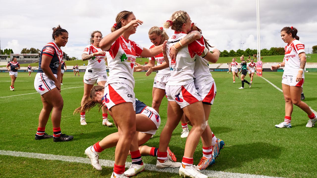 Emma Tonegato is congratulated by teammates after her try-saving tackle.