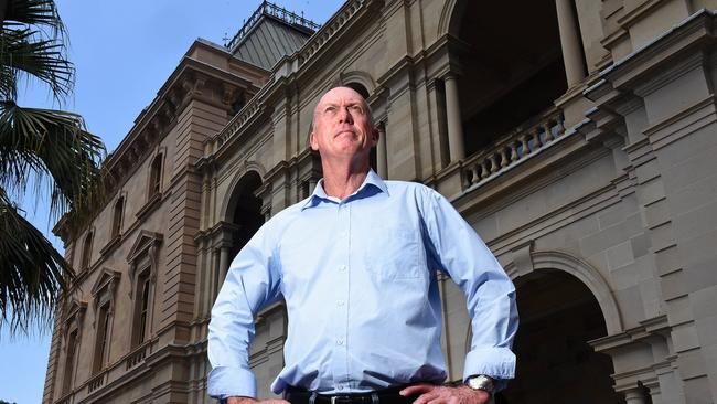 Pat Weir poses for a photograph at parliament in Brisbane.