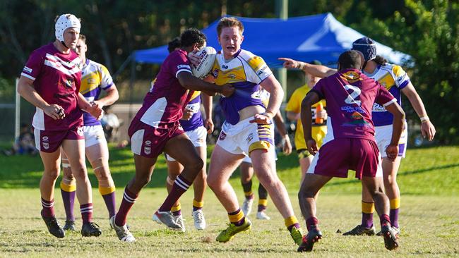 Edmonton's Corey Kennedy is tackled by Yarrabah’s defence. Picture: Nuno Avendano