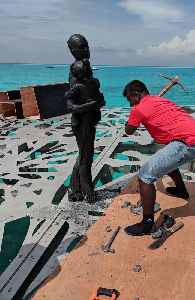 A pickaxe is taken to one of Jason DeCaires Taylor’s artworks. Picture: Maldives Police