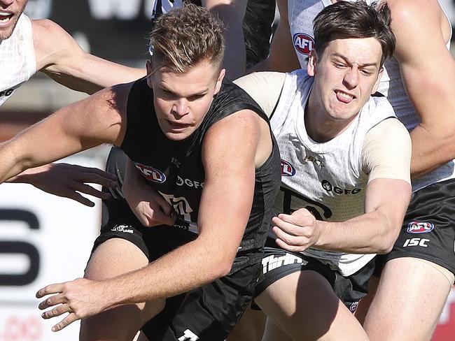 Port Adelaide Training at Alberton Oval. Dan Houston gets tackled by Zak Butters with Brad Ebert, Peter Ladhams and Wylie Buzza in the background. Picture SARAH REED