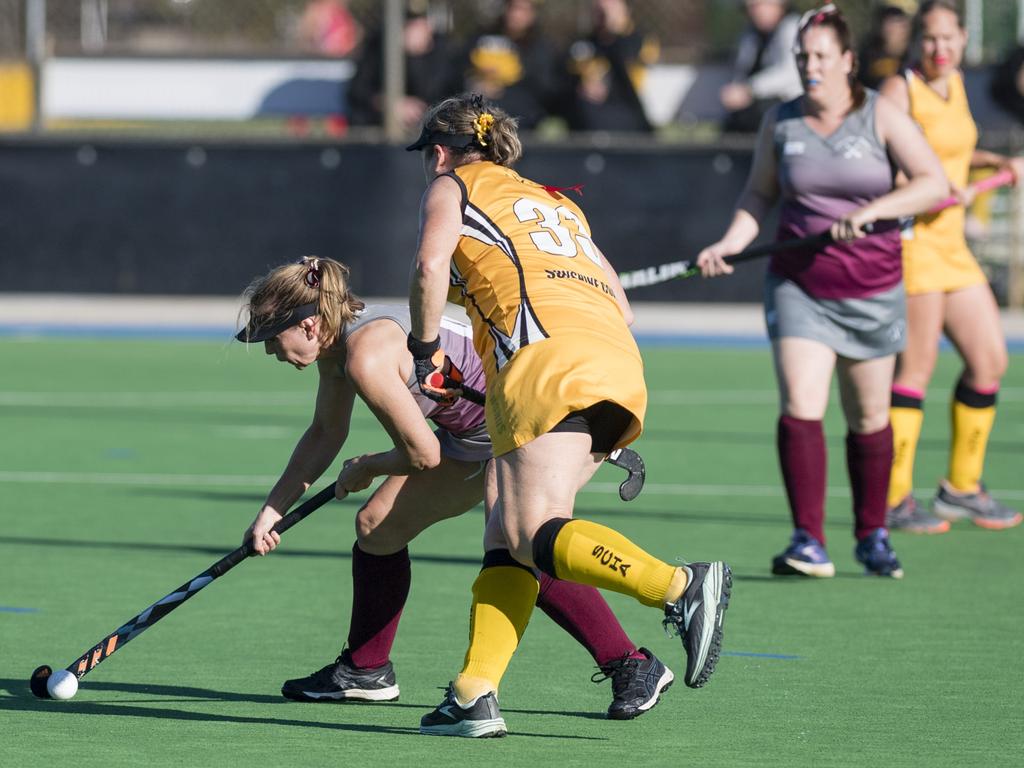 Kerry Slack (left) of Gladstone 1 against Sunshine Coast 2.