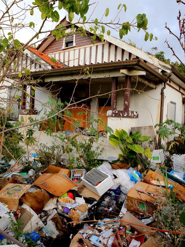 Mary Bobolas, whose house is pictured after rubbish accumulated again, says she cooks and bakes cakes inside. Picture: Stephen Cooper