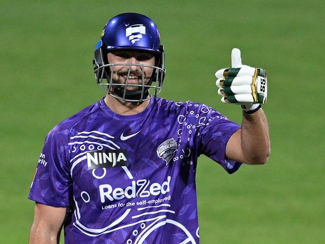 HOBART, AUSTRALIA - JANUARY 05: Tim David of the Hurricanes celebrates scoring a half century during the BBL match between the Hobart Hurricanes and Adelaide Strikers at Blundstone Arena, on January 05, 2025, in Hobart, Australia. (Photo by Steve Bell/Getty Images)