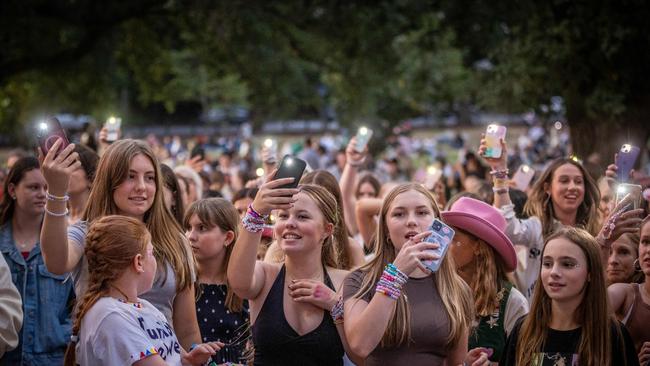 Fans listen to the concert from outside the MCG after missing out on tickets. Picture: NCA NewsWire / Jake Nowakowski