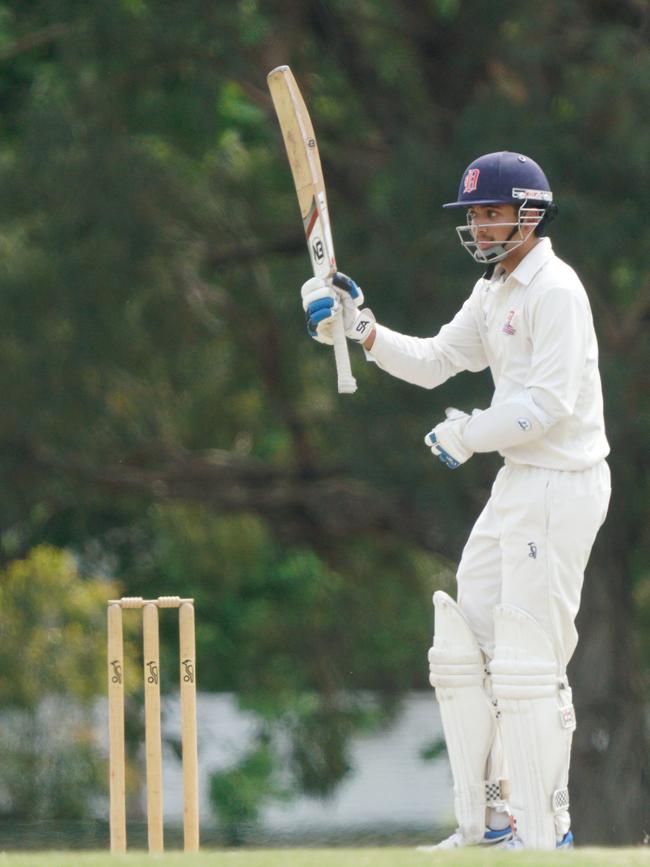 Gamage raises his bat. Picture: Valeriu Campan