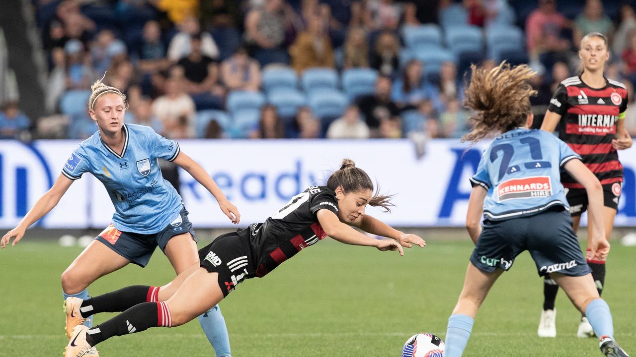 SYDNEY, AUSTRALIA – OCTOBER 14: Melissa Caceres of the Wanderers is tackled by Sydney FC's Zara Kruger during the round one A-League Women match between Sydney FC and Western Sydney Wanderers at Allianz Stadium on October 14, 2023 in Sydney, Australia. (Photo by Steve Christo/Corbis via Getty Images)