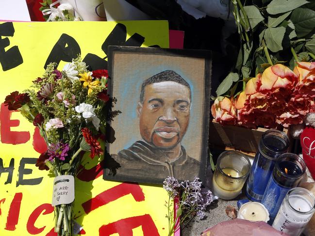 A chain portrait of George Floyd is part of the memorial for him in Minnesota. Picture: AP