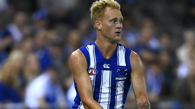 MELBOURNE, AUSTRALIA - MARCH 21: Jaidyn Stephenson of the Kangaroos kicks during the round one AFL match between the North Melbourne Kangaroos and the Port Adelaide Power at Marvel Stadium on March 21, 2021 in Melbourne, Australia. (Photo by Quinn Rooney/Getty Images)