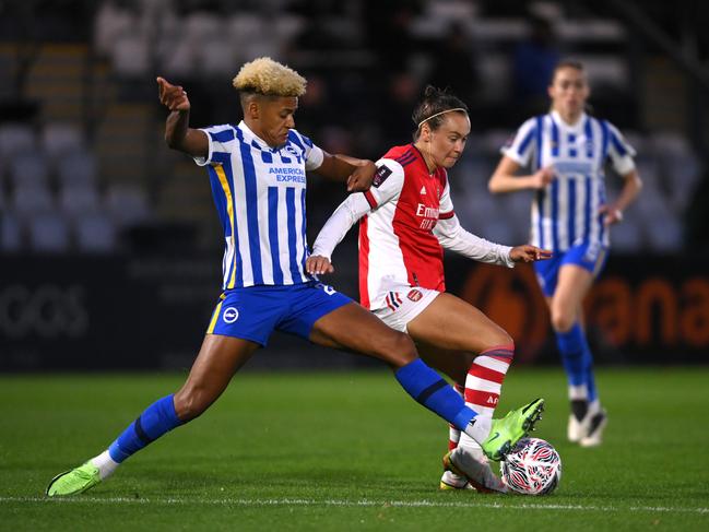 Arsenal’s Caitlin Foord (right) is challenged by Brighton’s Victoria Williams in the FA Cup semi-final. Picture: Mike Hewitt/Getty Images