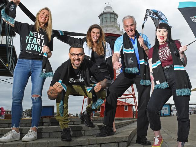 30/09/20 - Lighthouse Wharf Hotel owner Heidi Barreau, Spot Barber Shop owner Raph Hotota, Port Adelaide Enfield Mayor Claire Boan, Port Mall Newsagency owner Philip Jenner and Black Diamond Tattoo shop assistant Clare O'Neill getting excited for Port Adelaide's finals campaign.Picture: Tom Huntley