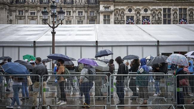 Parisians queue to be vaccinated against Covid-19 after French President Emmanuel Macron said vaccinations will be required for long-distance travel, indoor public spaces and restaurants and cafes. Picture: Getty Images