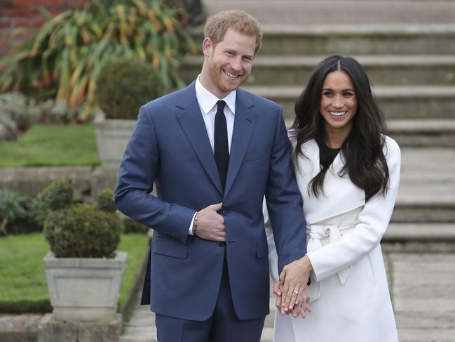 Prince Harry and his then fiancee Meghan Markle pose for a photograph at Kensington Palace following the announcement of their engagement. Photo: AFP.