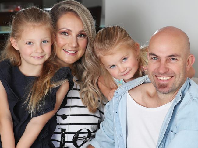 Mother-of-two Lisa Ware, 37, and her husband Michael, 38, with daughters Isabelle 5 and Emelia 3. They recently refinanced their home loan to save money and are also accessing free childcare. They are worried about their jobs during the coronavirus pandemic. Friday, April 10, 2020. Picture: David Crosling