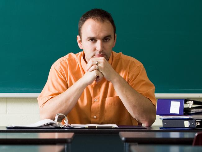 Teacher in empty classroom